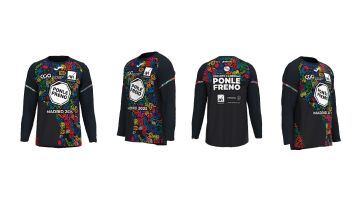 Así es la camiseta de la Carrera Ponle Freno Madrid 2025: de color negro, con llamativos símbolos de colores y componentes reflectantes en mangas y pecho